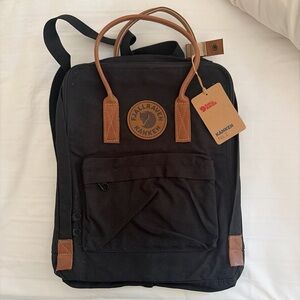 Fjallraven Kånken Black Backpack with Brown Leather Accents